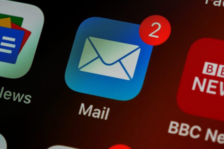 brett-jordan-LPZy4da9aRo-unsplash-scaled.jpg closeup of mail app icon on phone