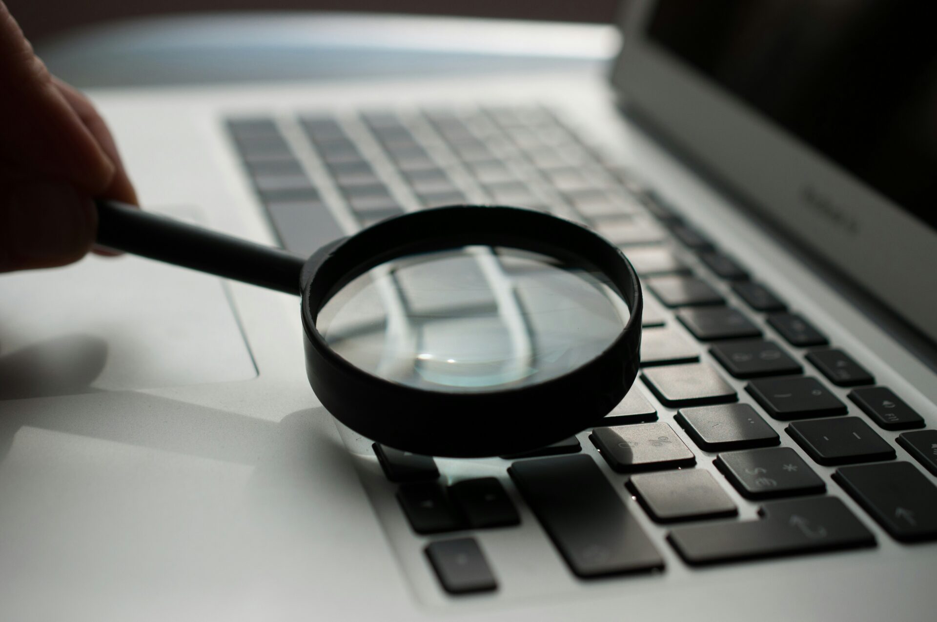 agence-olloweb-d9ILr-dbEdg-unsplash.jpg magnifying glass near gray laptop computer